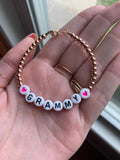 Black letters on white beads WITHOUT metallics between