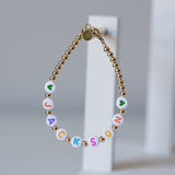 Pastel letters on white beads WITH metallics between