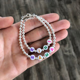 Pastel letters on white beads WITH metallics between