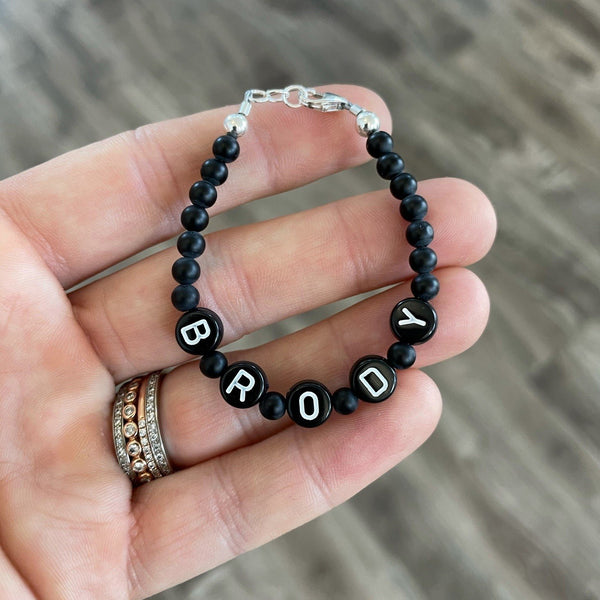 White letters on black beads WITH matte black between