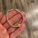 The Metallic Smiley Face Bracelet