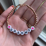 Black letters on white beads WITHOUT metallics between