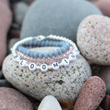 Black letters on white beads WITH metallics between