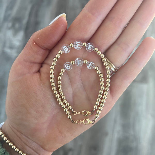 White letters on CLEAR beads WITH metallics between