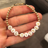 Gold letters on white beads WITHOUT metallics between