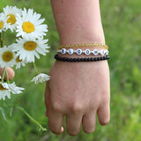 Black letters on white beads WITH metallics between