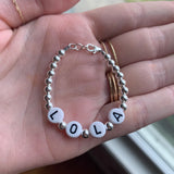 Black letters on white beads WITH metallics between