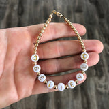 Gold letters on white beads WITH metallics between