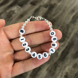 Phone number bracelet - Black numbers on white beads