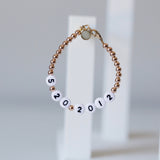 Date number bracelet - Black numbers on white beads