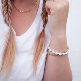 Gold letters on white beads WITH metallics between