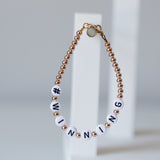 Black letters on white beads WITH metallics between