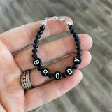 White letters on black beads WITH matte black between